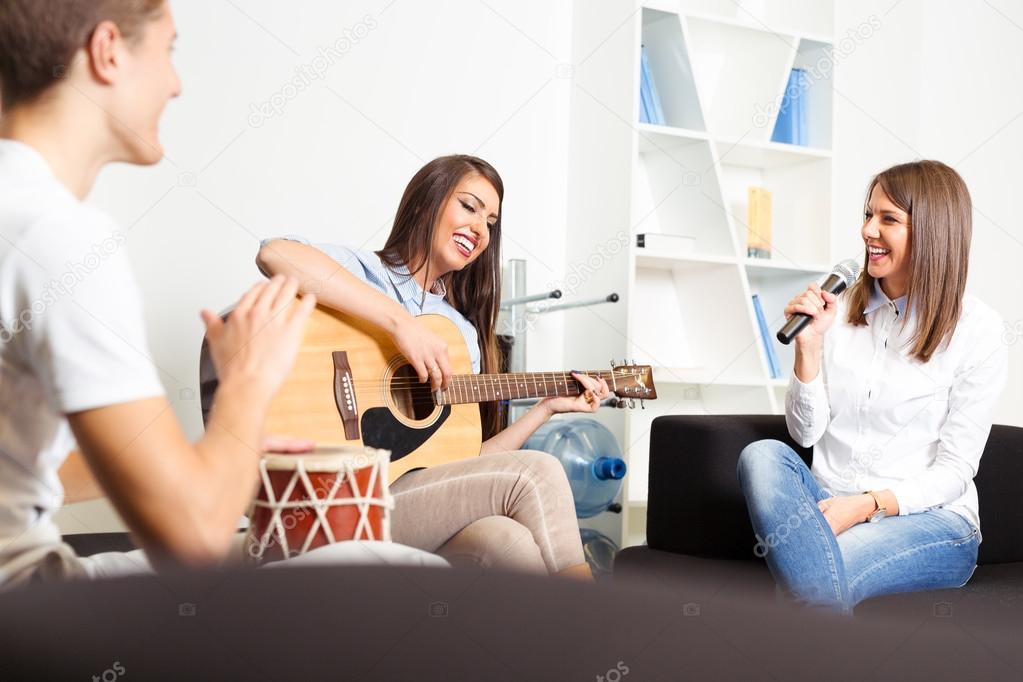 depositphotos 128036698 stock photo friends enjoying playing guitar and